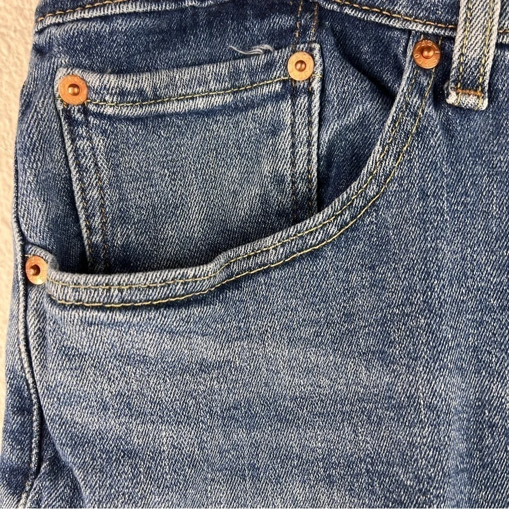 LEVI’S 550 JEANS. Great used condition. Size 38/32. Medium Wash. Frayed hems
